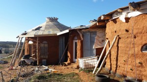 earthbag home with pallet decking on roof