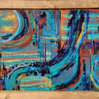 blue red and gold abstract art painting in frame